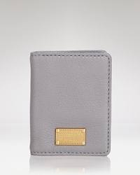Key in and covet this MARC BY MARC JACOBS card case, coolly crafted of leather with understated details. Key in and covet this MARC BY MARC JACOBS card case, coolly crafted of leather with understated details.