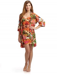 THE LOOKAllover abstract floral printWrap front with cinched drawstring tie closureElbow length sleevesTHE FITAbout 36 from shoulder to hemTHE MATERIALPolyester/spandexCARE & ORIGINMachine washImportedModel shown is 5'10 (177cm) wearing US size Small. THE LOOKAllover abstract floral printWrap front with cinched drawstring tie closureElbow length sleevesTHE FITAbout 36 from shoulder to hemTHE MATERIALPolyester/spandexCARE & ORIGINMachine washImportedModel shown is 5'10 (177cm) wearing US size Small.