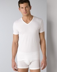 Emporio Armani stretch cotton V-neck. Tagless V-neck tee with eagle logo sealed on the chest. Emporio Armani stretch cotton V-neck. Tagless V-neck tee with eagle logo sealed on the chest.