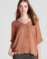 Ease into spring in a luxe Vince top rendered in a rich copper hue and featuring beautiful details. Elevate casual separates with this silk silhouette, which travels through the seasons with true elegance. Ease into spring in a luxe Vince top rendered in a rich copper hue and featuring beautiful details. Elevate casual separates with this silk silhouette, which travels through the seasons with true elegance.