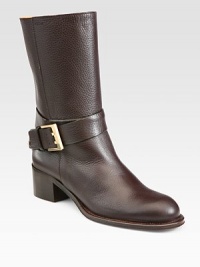 Classic leather design with a wrapped leather studded strap and metal buckle. Stacked heel, 2 (50mm)Shaft, 9¼Leg circumference, 13Leather upperLeather lining and solePadded insoleMade in ItalyOUR FIT MODEL RECOMMENDS ordering one half size up as this style runs small. Classic leather design with a wrapped leather studded strap and metal buckle. Stacked heel, 2 (50mm)Shaft, 9¼Leg circumference, 13Leather upperLeather lining and solePadded insoleMade in ItalyOUR FIT MODEL RECOMMENDS ordering one half size up as this style runs small.