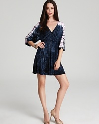A splashy tie-dye print makes a vibrant statement atop this Nola Z tunic dress. Slip the style over a strappy bikini for a day at the beach, then team with polished heels for a night out. A splashy tie-dye print makes a vibrant statement atop this Nola Z tunic dress. Slip the style over a strappy bikini for a day at the beach, then team with polished heels for a night out.