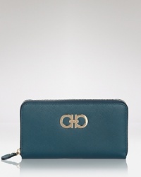The essential Salvatore Ferragamo wallet is upgraded in subtly textured saffiano leather, distinguished by the luxury maker's signature Gancini hardware. The essential Salvatore Ferragamo wallet is upgraded in subtly textured saffiano leather, distinguished by the luxury maker's signature Gancini hardware.