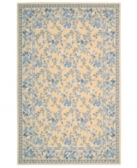 Attractive floral images make this country-style rug a delightful addition to any room. Woven from plush wool, the Country Heritage rug features a muted yellow field, speckled with beautiful blues and whites. Attractive floral images make this country-style rug a delightful addition to any room. Woven from plush wool, the Country Heritage rug features a muted yellow field, speckled with beautiful blues and whites.