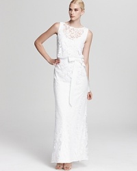 Luxe in lace, Tadashi Shoji's ladylike dress shows off a sleeveless silhouette and a flattering, ribbon-detailed waist. Luxe in lace, Tadashi Shoji's ladylike dress shows off a sleeveless silhouette and a flattering, ribbon-detailed waist.