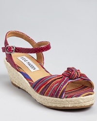 A very grown-up look from Steve Madden, the Cusp sandals contrast a rich multicolor upper with muted espadrille trim along the sides. A very grown-up look from Steve Madden, the Cusp sandals contrast a rich multicolor upper with muted espadrille trim along the sides.