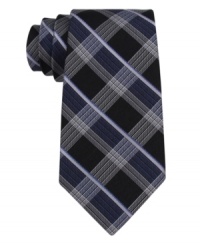 Proper plaid puts some zest into your workweek wardrobe with this DKNY silk tie. Proper plaid puts some zest into your workweek wardrobe with this DKNY silk tie.