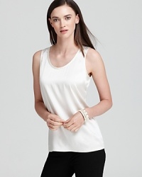Luxe silk inspires an effortless Eileen Fisher top for a flawlessly feminine silhouette. Slip a tuxedo jacket over the style for the perfect boy-meets-girl mix. Luxe silk inspires an effortless Eileen Fisher top for a flawlessly feminine silhouette. Slip a tuxedo jacket over the style for the perfect boy-meets-girl mix.