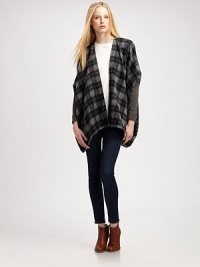Give your cool-weather wardrobe a hit of flair with this plaid, mixed-media poncho with dropped shoulders and a lengthy silhouette. Open frontPoncho sleeves with rib-knit cuffsContoured asymmetrical hemAbout 29 from shoulder to hem50% acrylic/30% wool/20% nylonHand washImportedModel shown is 5'10 (177cm) wearing US size XS/S. Give your cool-weather wardrobe a hit of flair with this plaid, mixed-media poncho with dropped shoulders and a lengthy silhouette. Open frontPoncho sleeves with rib-knit cuffsContoured asymmetrical hemAbout 29 from shoulder to hem50% acrylic/30% wool/20% nylonHand washImportedModel shown is 5'10 (177cm) wearing US size XS/S.