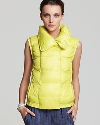 A quintessential layering piece bulks up and blasts off in a vibrant citrus hue on this Vince puffer vest, perfect for brightening up dreary winter days. A quintessential layering piece bulks up and blasts off in a vibrant citrus hue on this Vince puffer vest, perfect for brightening up dreary winter days.
