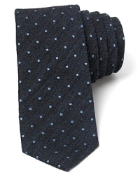 With an underlay of subtle herringbone and an allover pattern of dots, this skinny modern tie deserves attention. With an underlay of subtle herringbone and an allover pattern of dots, this skinny modern tie deserves attention.