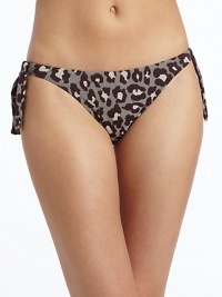 THE LOOKAllover leopard printSide tiesElastic waist and leg openingsTHE MATERIAL80% nylon/20% spandexFully linedCARE & ORIGINHand washMade in USAPlease note: Bikini top sold separately. THE LOOKAllover leopard printSide tiesElastic waist and leg openingsTHE MATERIAL80% nylon/20% spandexFully linedCARE & ORIGINHand washMade in USAPlease note: Bikini top sold separately.