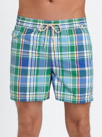 The classic Traveler swim short is rendered in sleek, quick-drying microfiber in a vibrant plaid pattern for cool, casual beach style.Elastic waistband with drawstring tie closureSide slash pocketsBack waist drainage grommetsBack flap patch pocketMesh liningInseam, about 4¾52% cotton/48% nylonMachine washImported The classic Traveler swim short is rendered in sleek, quick-drying microfiber in a vibrant plaid pattern for cool, casual beach style.Elastic waistband with drawstring tie closureSide slash pocketsBack waist drainage grommetsBack flap patch pocketMesh liningInseam, about 4¾52% cotton/48% nylonMachine washImported