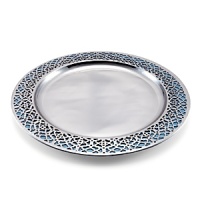 With a stainless steel Moroccan filigree design overlay and Julia Knight's trademark blend of enamel infused with crushed mother of pearl underneath, this Marrakesh-inspired charger combines beauty and functionality and brings colorful elegance to your table.
