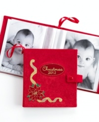 Personalize your tree and keep loved ones near with the photo album ornament from Holiday Lane. Featuring a dated cover and embroidered poinsettia motif in bold red. Personalize your tree and keep loved ones near with the photo album ornament from Holiday Lane. Featuring a dated cover and embroidered poinsettia motif in bold red.