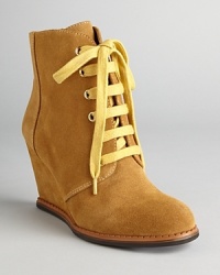 These booties wedge multiple trends into one tied-together style, with lace up vamps and athletic influences; from kate spade new york. These booties wedge multiple trends into one tied-together style, with lace up vamps and athletic influences; from kate spade new york.