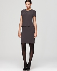 A fluttering peplum lends poetic dimension to a structured Gerard Darel sheath dress. Accentuate the sculptural silhouette with sheer black tights.