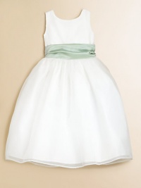 A sleeveless masterpiece for her special moments, designed in pretty organza with a full skirt and contrasting sash at the waist. Built-in slip with crinolineNatural waist with sashBack button closureTea lengthFully linedPolyesterHand washImported A sleeveless masterpiece for her special moments, designed in pretty organza with a full skirt and contrasting sash at the waist. Built-in slip with crinolineNatural waist with sashBack button closureTea lengthFully linedPolyesterHand washImported