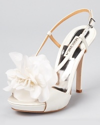 Feminine and floral, these flowering sandals from Badgley Mischka are wondrous in white. Feminine and floral, these flowering sandals from Badgley Mischka are wondrous in white.