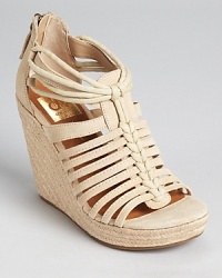 A strappy sandal from Dolce Vita, the Tatiana wedges exude summer style with a raffia heel. A strappy sandal from Dolce Vita, the Tatiana wedges exude summer style with a raffia heel.