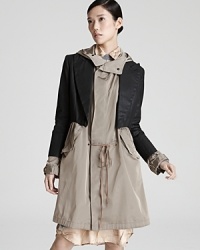 A fashion-forward take on the trench, this Jean Paul Gaultier jacket incorporates a tuxedo-inspired bolero design into this silhouette for a modern silhouette that works the color-block trend with sharp sophistication. A fashion-forward take on the trench, this Jean Paul Gaultier jacket incorporates a tuxedo-inspired bolero design into this silhouette for a modern silhouette that works the color-block trend with sharp sophistication.