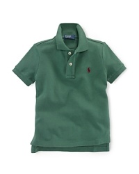 A classic polo shirt crafted from breathable cotton mesh is tailored in a short-sleeved silhouette for preppy, warm-weather style. A classic polo shirt crafted from breathable cotton mesh is tailored in a short-sleeved silhouette for preppy, warm-weather style.