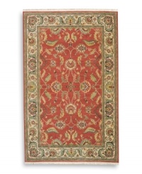 Inspired by the lush tapestries of the 17th-century Mogul dynasty, this classic Agra rug features a scrolling vine design of oversized palmettes and serrated leaves. The green and ivory tones in the palmette border perfectly complement the dynamic color shadings of the rich red ground. Special color treatment creates a gentle finish. Woven of premium worsted New Zealand wool for indulgent softness. Inspired by the lush tapestries of the 17th-century Mogul dynasty, this classic Agra rug features a scrolling vine design of oversized palmettes and serrated leaves. The green and ivory tones in the palmette border perfectly complement the dynamic color shadings of the rich red ground. Special color treatment creates a gentle finish. Woven of premium worsted New Zealand wool for indulgent softness.