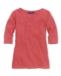 A soft ribbed cotton jersey top is updated with lace trim and a ribbon accent at the neckline. A soft ribbed cotton jersey top is updated with lace trim and a ribbon accent at the neckline.