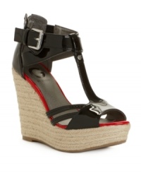 The bolder the better. A contrast footbed lends trendy color blocked appeal to the patent shine of the Talloys wedge sandals from G by GUESS. The bolder the better. A contrast footbed lends trendy color blocked appeal to the patent shine of the Talloys wedge sandals from G by GUESS.