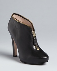 Zip into these stylish DIANE von FURSTENBERG platform booties; bold around-the-cuff hardware gives them the perfect amount of edge. Zip into these stylish DIANE von FURSTENBERG platform booties; bold around-the-cuff hardware gives them the perfect amount of edge.