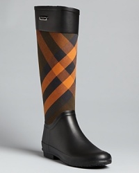 Checkmates: these classically Burberry rain boots give plaid added punch in a cheerful shade of orange. Checkmates: these classically Burberry rain boots give plaid added punch in a cheerful shade of orange.