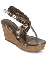 Shine bright in the sheen of these wedges. Carlos by Carlos Santana's Sun platform sandals feature a single metallic animal-print strap that wraps around the ankle and is topped with a cute side buckle. Shine bright in the sheen of these wedges. Carlos by Carlos Santana's Sun platform sandals feature a single metallic animal-print strap that wraps around the ankle and is topped with a cute side buckle.