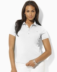 Designed for a trim, body-skimming fit in soft finely ribbed cotton, the iconic polo shirt receives a chic update with gleaming silver-tone metal buttons. Designed for a trim, body-skimming fit in soft finely ribbed cotton, the iconic polo shirt receives a chic update with gleaming silver-tone metal buttons.