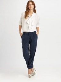 A softened take on the tailored button-down, crafted from silk chiffon and styled with a chic tie-neck collar.Gathered shouldersButton-frontThree-quarter sleevesShirttail hemGathered back yokeAbout 23 from shoulder to hem95% silk/5% spandexDry cleanImportedModel shown is 5'8½ (174cm) wearing US size Small.
