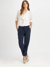 A softened take on the tailored button-down, crafted from silk chiffon and styled with a chic tie-neck collar.Gathered shouldersButton-frontThree-quarter sleevesShirttail hemGathered back yokeAbout 23 from shoulder to hem95% silk/5% spandexDry cleanImportedModel shown is 5'8½ (174cm) wearing US size Small. A softened take on the tailored button-down, crafted from silk chiffon and styled with a chic tie-neck collar.Gathered shouldersButton-frontThree-quarter sleevesShirttail hemGathered back yokeAbout 23 from shoulder to hem95% silk/5% spandexDry cleanImportedModel shown is 5'8½ (174cm) wearing US size Small.