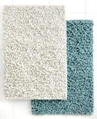 Treat your toes to texture! The Loopi bath rug boasts generous cotton loops that make your steps to and from the shower a dream. Features a latex back. Treat your toes to texture! The Loopi bath rug boasts generous cotton loops that make your steps to and from the shower a dream. Features a latex back.