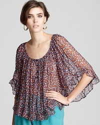 Appealing to your inner romantic, this French Connection top blooms with florals on a sheer, pleated silhouette for effortless femininity. Appealing to your inner romantic, this French Connection top blooms with florals on a sheer, pleated silhouette for effortless femininity.