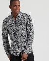 A dramatic paisley pattern adorns this striking button-down from Michael Kors, keeping your look exciting and modern.