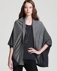 Crisp color blocking emboldens an effortless Eileen Fisher cardigan for chic everyday style. Crisp color blocking emboldens an effortless Eileen Fisher cardigan for chic everyday style.