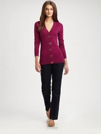 Oversized Tory Burch buttons add a brilliant touch to this merino-wool cardigan with classic ribbed trim.V-neckLong sleevesButton frontRibbed trimAbout 26 from shoulder to hemMerino woolDry cleanImported Model shown is 5'9½ (176cm) wearing US size Small. Oversized Tory Burch buttons add a brilliant touch to this merino-wool cardigan with classic ribbed trim.V-neckLong sleevesButton frontRibbed trimAbout 26 from shoulder to hemMerino woolDry cleanImported Model shown is 5'9½ (176cm) wearing US size Small.