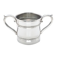 Designed with double bands of beads, this Reed & Barton baby cup has two handles for a child's easy drinking. Crafted in tarnish-resistant pewter, it offers classic good looks. Designed with double bands of beads, this Reed & Barton baby cup has two handles for a child's easy drinking. Crafted in tarnish-resistant pewter, it offers classic good looks.