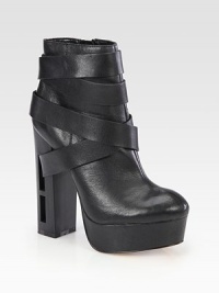 Street-cool strappy leather design, lifted by a towering wooden heel with modern cutouts. Wooden cutout heel, 5½ (140mm)Leather-covered platform, 1½ (40mm)Compares to a 4 heel (100mm)Leather upperSide zipLeather lining and solePadded insoleImported Street-cool strappy leather design, lifted by a towering wooden heel with modern cutouts. Wooden cutout heel, 5½ (140mm)Leather-covered platform, 1½ (40mm)Compares to a 4 heel (100mm)Leather upperSide zipLeather lining and solePadded insoleImported