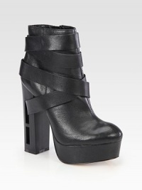 Street-cool strappy leather design, lifted by a towering wooden heel with modern cutouts. Wooden cutout heel, 5½ (140mm)Leather-covered platform, 1½ (40mm)Compares to a 4 heel (100mm)Leather upperSide zipLeather lining and solePadded insoleImported