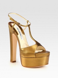 Instantly chic t-strap silhouette of metallic leather with an ultra-high heel and platform. Self-covered heel, 5¾ (145mm)Covered platform, 2 (50mm)Compares to a 3¾ heel (95mm)Metallic leather upperAdjustable ankle strapLeather lining and solePadded insoleMade in Italy Instantly chic t-strap silhouette of metallic leather with an ultra-high heel and platform. Self-covered heel, 5¾ (145mm)Covered platform, 2 (50mm)Compares to a 3¾ heel (95mm)Metallic leather upperAdjustable ankle strapLeather lining and solePadded insoleMade in Italy