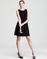 A sleek city basic, this DKNY dress gains feminine flair with delicate pleats and sheer styling. Sky-high pumps inject the style with provocative edge. A sleek city basic, this DKNY dress gains feminine flair with delicate pleats and sheer styling. Sky-high pumps inject the style with provocative edge.