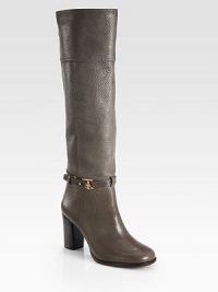 Rich pebble-grain leather forms this towering design, with a wrap-around ankle strap and stacked heel. Stacked heel, 3¼ (80mm)Shaft, 17¼Leg circumference, 14Leather upperWrap-around ankle strap with metal tab closureBack zipLeather lining and solePadded insoleImportedThis style runs true to size. We recommend ordering your usual size for a standard fit. Rich pebble-grain leather forms this towering design, with a wrap-around ankle strap and stacked heel. Stacked heel, 3¼ (80mm)Shaft, 17¼Leg circumference, 14Leather upperWrap-around ankle strap with metal tab closureBack zipLeather lining and solePadded insoleImportedThis style runs true to size. We recommend ordering your usual size for a standard fit.