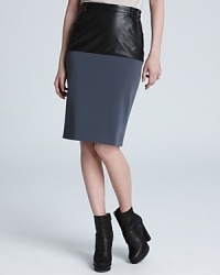 This Jean Paul Gaultier puts a forward spin on a classic look adding a sleek leather panel to a stretch pencil skirt for the ultimate example of day-to-night style. This Jean Paul Gaultier puts a forward spin on a classic look adding a sleek leather panel to a stretch pencil skirt for the ultimate example of day-to-night style.