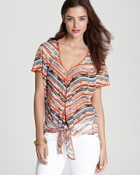 Imbued with a vibrant print, this Sam & Lavi top can be styled two ways -- tied at the hem or cascading down. Imbued with a vibrant print, this Sam & Lavi top can be styled two ways -- tied at the hem or cascading down.