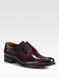 Leather lace-up style, highlighting impeccable stitching and attention to detail with perforated toe detail and comfortable leather sole.Leather upperLeather liningPadded insoleLeather soleMade in Italy Leather lace-up style, highlighting impeccable stitching and attention to detail with perforated toe detail and comfortable leather sole.Leather upperLeather liningPadded insoleLeather soleMade in Italy