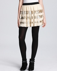 Silver sequined stripes add party-poised pizazz to this festive little Free People skirt. Silver sequined stripes add party-poised pizazz to this festive little Free People skirt.